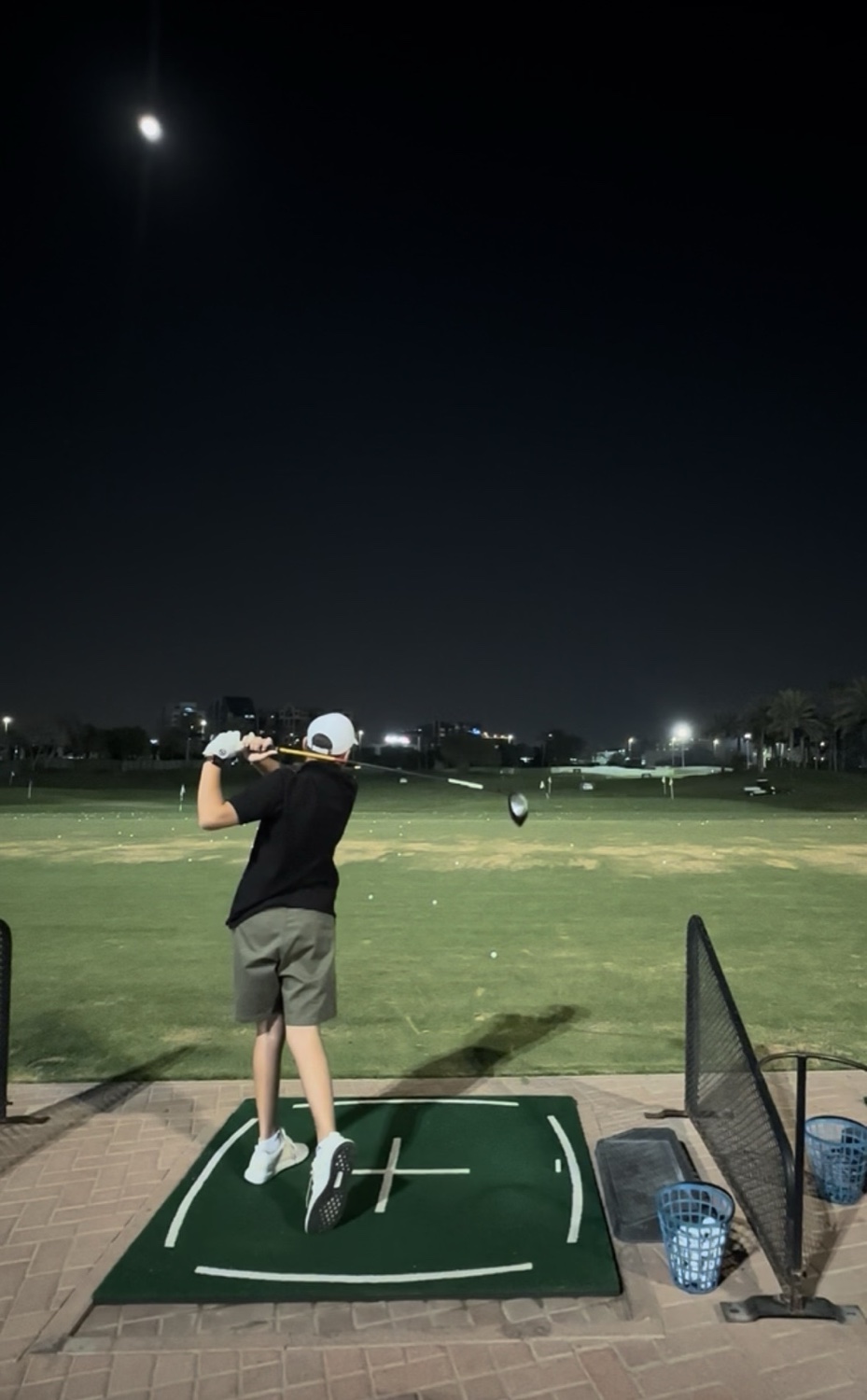 Full swing on the range under the moon